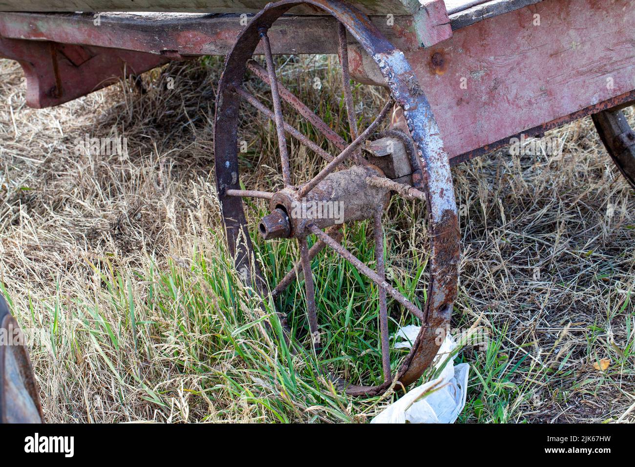 part of an old cart on metal wheels, part of an old transport on the traction power of horses Stock Photo