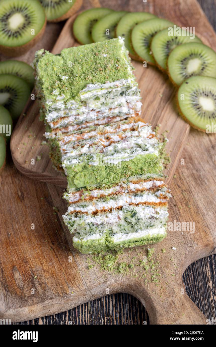 a piece of green cake with creamy filling, fresh and sweet green cake