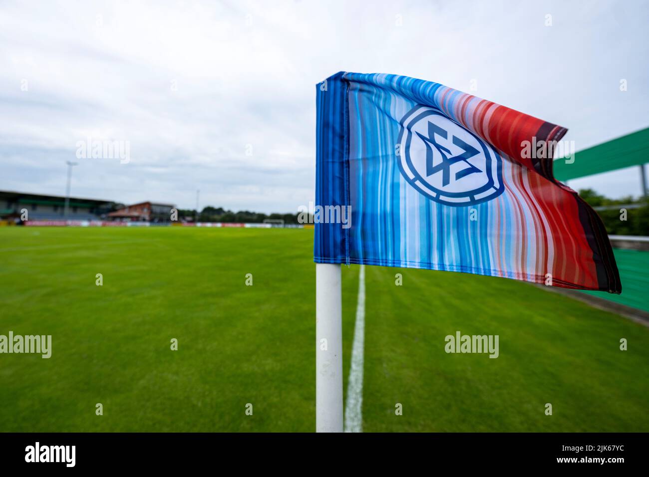 Rehden, Germany. 31st July, 2022. Soccer: DFB Cup, BSV Rehden - SV  Sandhausen, 1st round, Waldsportstätten sports field: The corner flag with  DFB logo is blowing in the wind. Credit: David Inderlied/dpa -