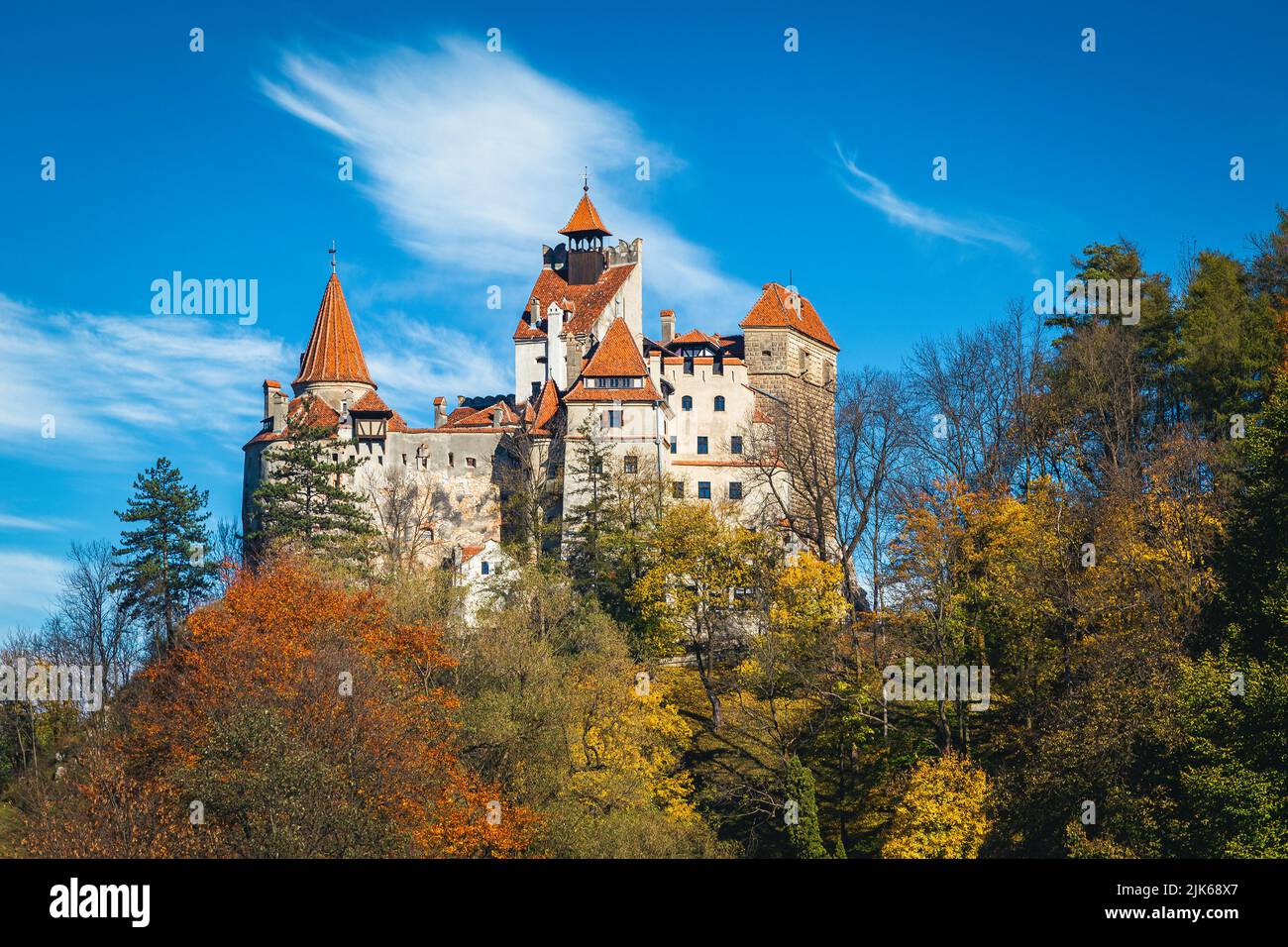 Famous Dracula castle in the colorful deciduous autumn forest, Bran, Transylvania, Romania, Europe Stock Photo
