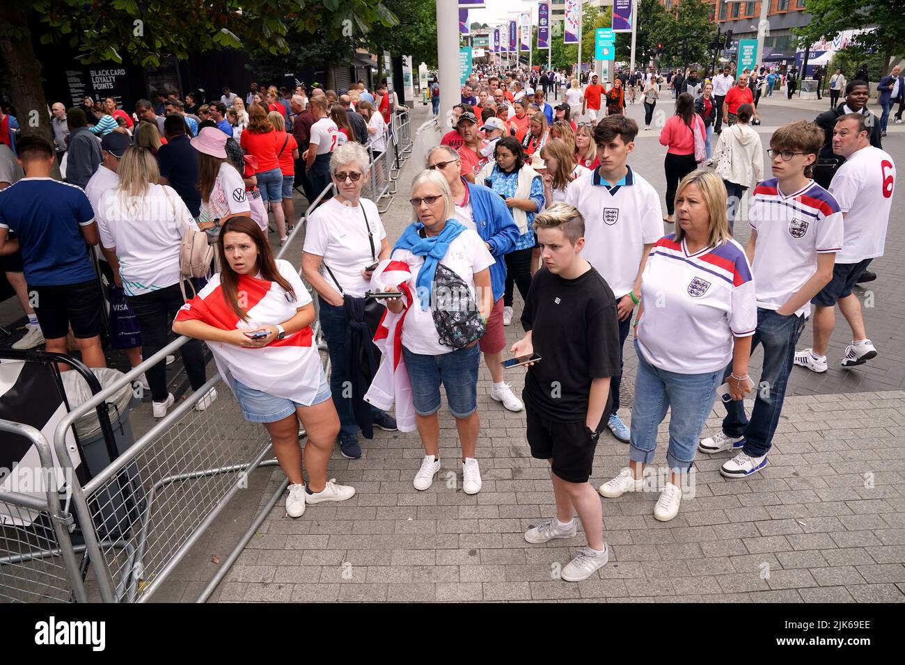 England fans queue to get into the Wembley fan park ahead of the UEFA