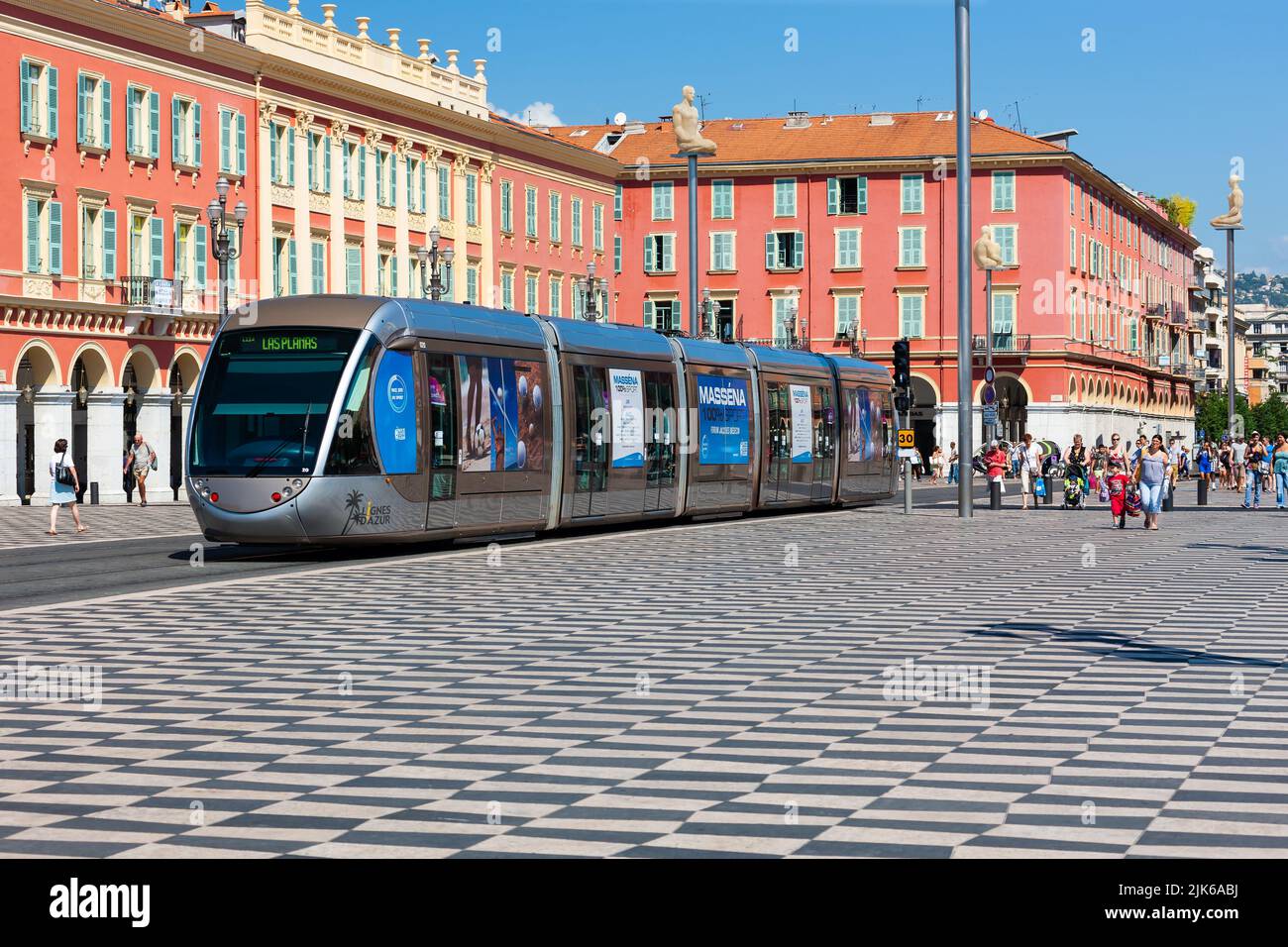Nice, France - July 23, 2011 : Public tram running south on Ave Jean Medecin through a chequered public square. Stock Photo