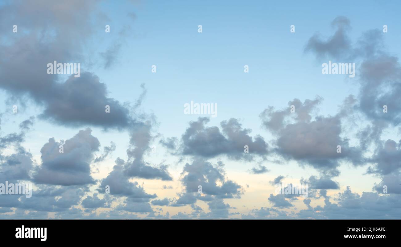White, fluffy clouds in blue sky. Background from clouds Stock Photo