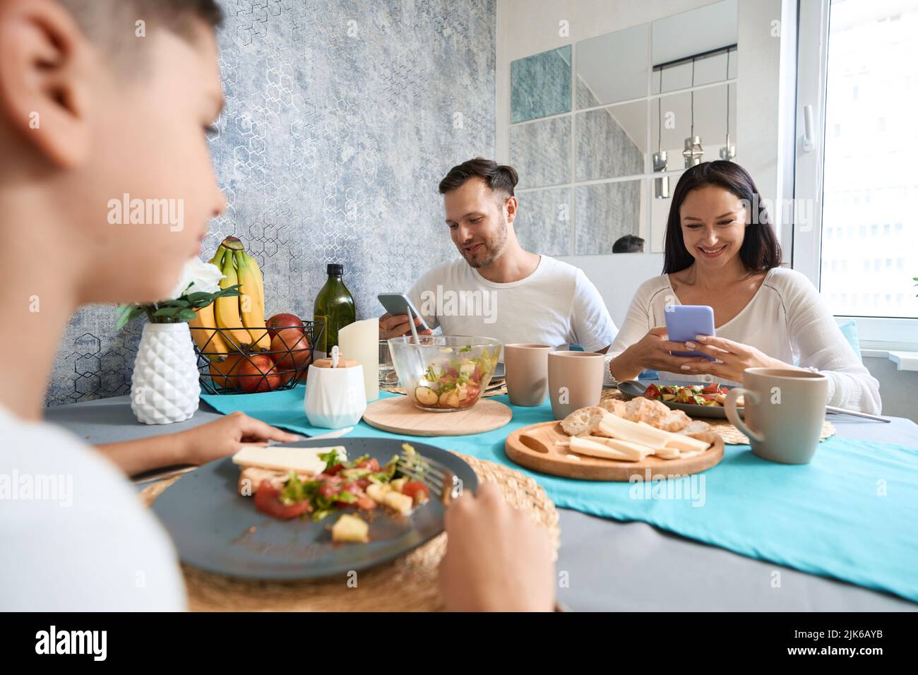 Illusory life in a smartphone displaces family values Stock Photo