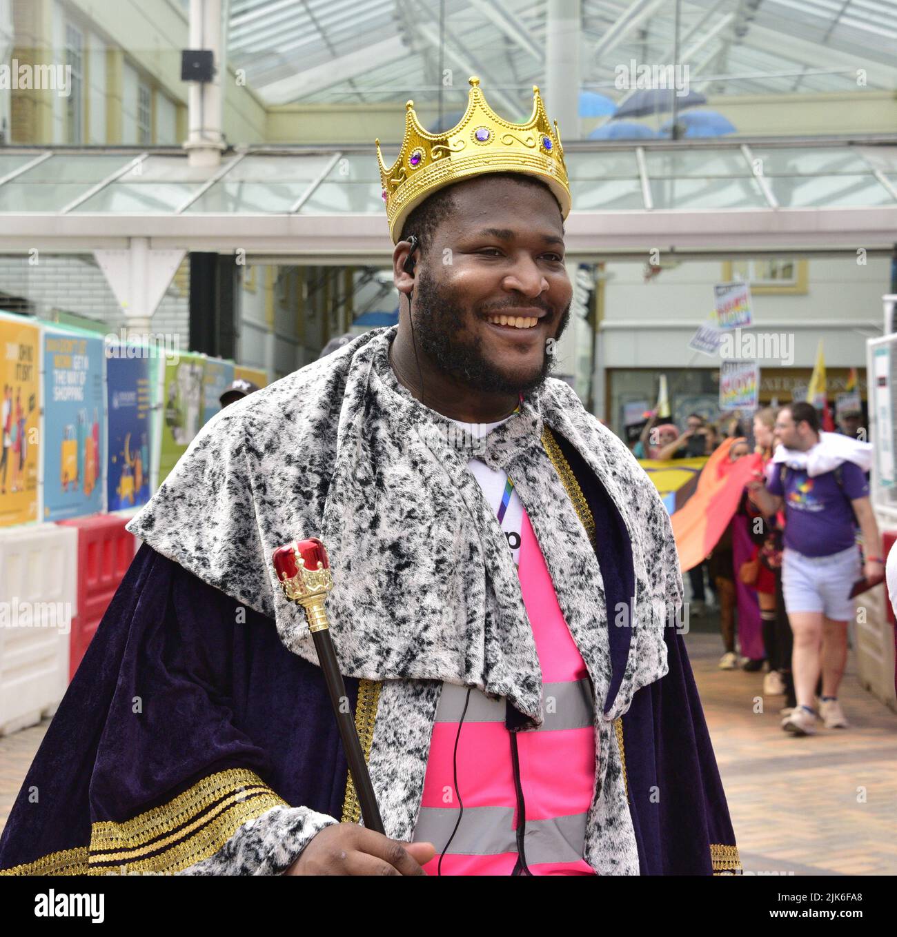 Stockport, UK, 31st July, 2022. Man wears crown and robe. Stockport LGBTQ+ Pride Parade in Stockport, Greater Manchester, England, United Kingdom, British Isles. Organisers say the parade is: 'Celebrating Stockport's LGBTQ+'. Community'. The parade marched from Bridgefield Street to Stockport's historic Market Place. Credit: Terry Waller/Alamy Live News Stock Photo
