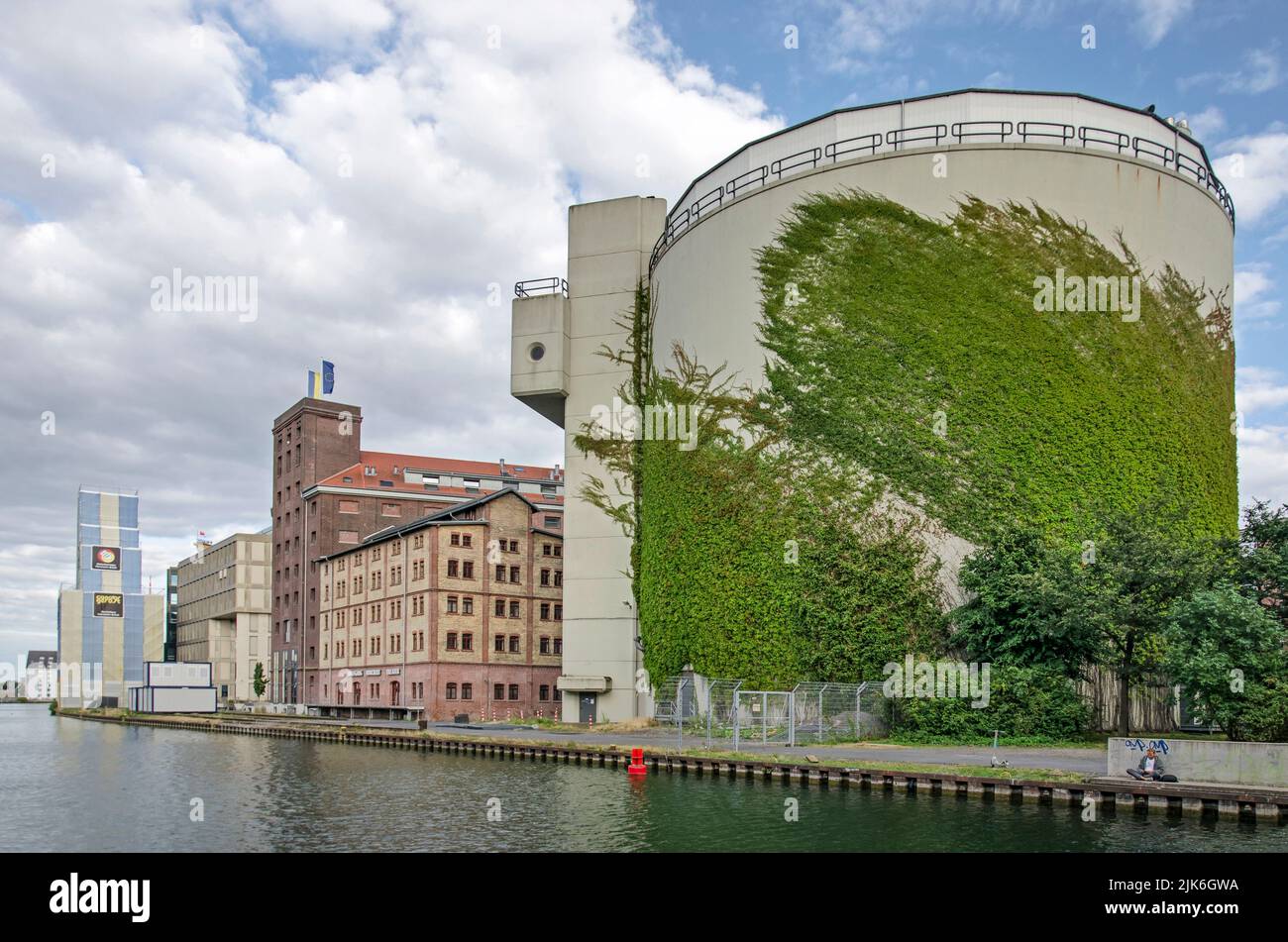 Münster, Germany, July 27, 2022: large silo covered with ivy, as well as other buildings in the redeveloped harbour district Stock Photo