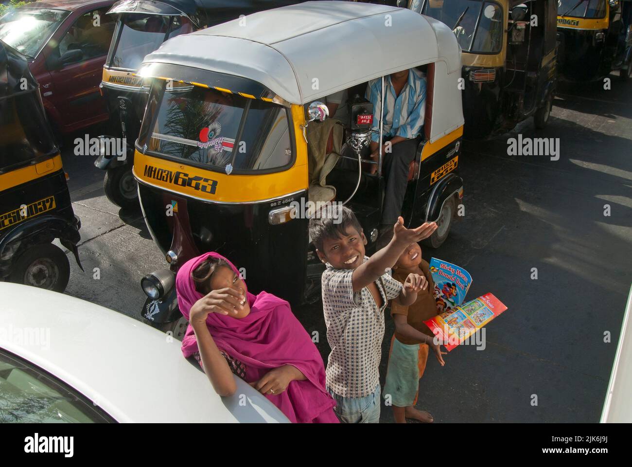 Kids selling in traffic - India Stock Photo