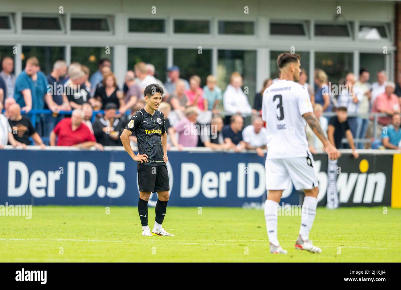 Rehden, Germany. 31st July, 2022. Soccer: DFB-Pokal, BSV Rehden - SV Sandhausen, 1st round, Waldsportstätten sports field: Rehden's Ka-ram Han is disappointed after the final whistle. Credit: David Inderlied/dpa - IMPORTANT NOTE: In accordance with the requirements of the DFL Deutsche Fußball Liga and the DFB Deutscher Fußball-Bund, it is prohibited to use or have used photographs taken in the stadium and/or of the match in the form of sequence pictures and/or video-like photo series./dpa/Alamy Live News Stock Photo