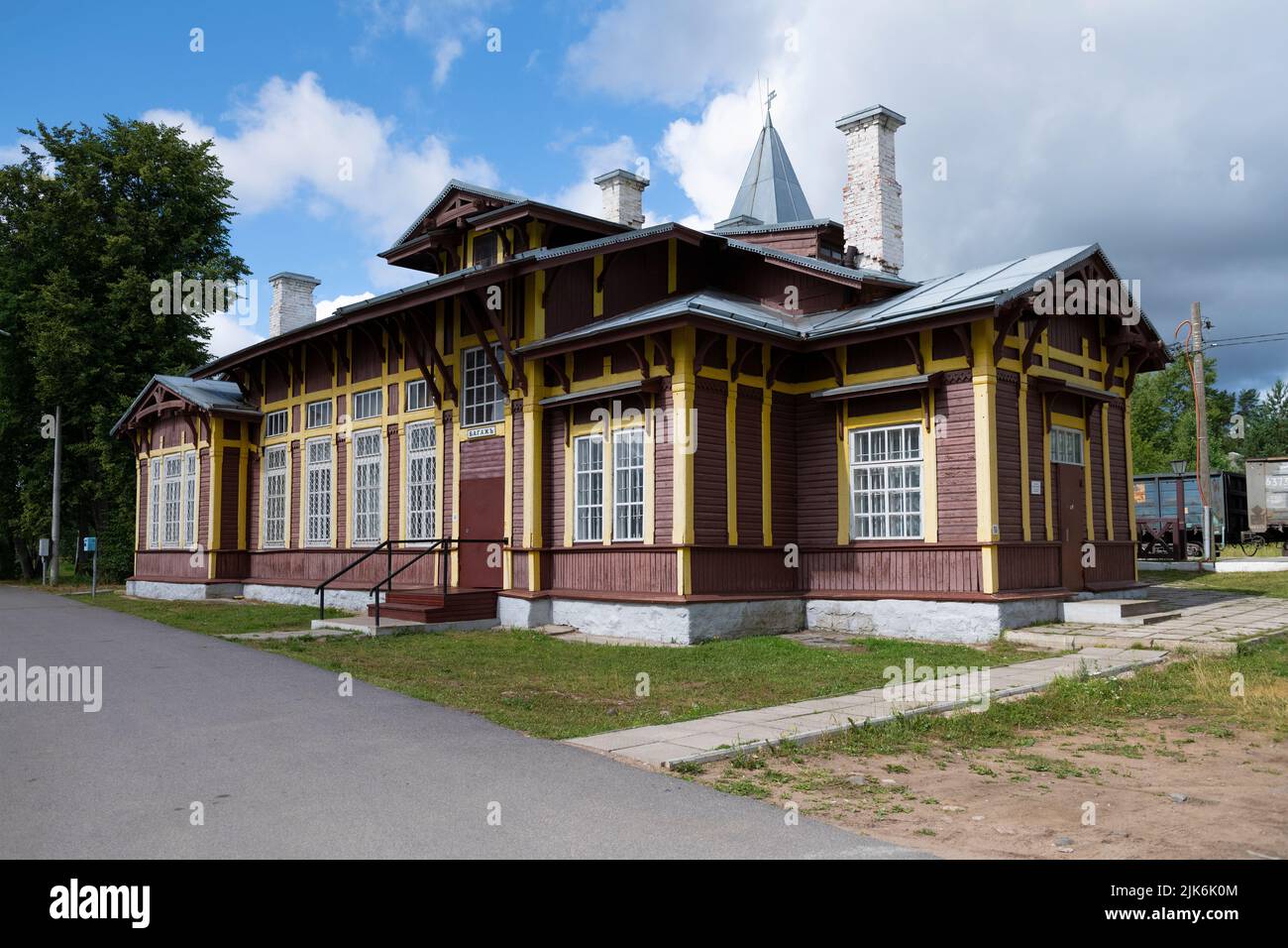KUZHENKINO, RUSSIA - JULY 16, 2022: Old wooden building of the railway station on Kuzhenkino station on July afternoon Stock Photo