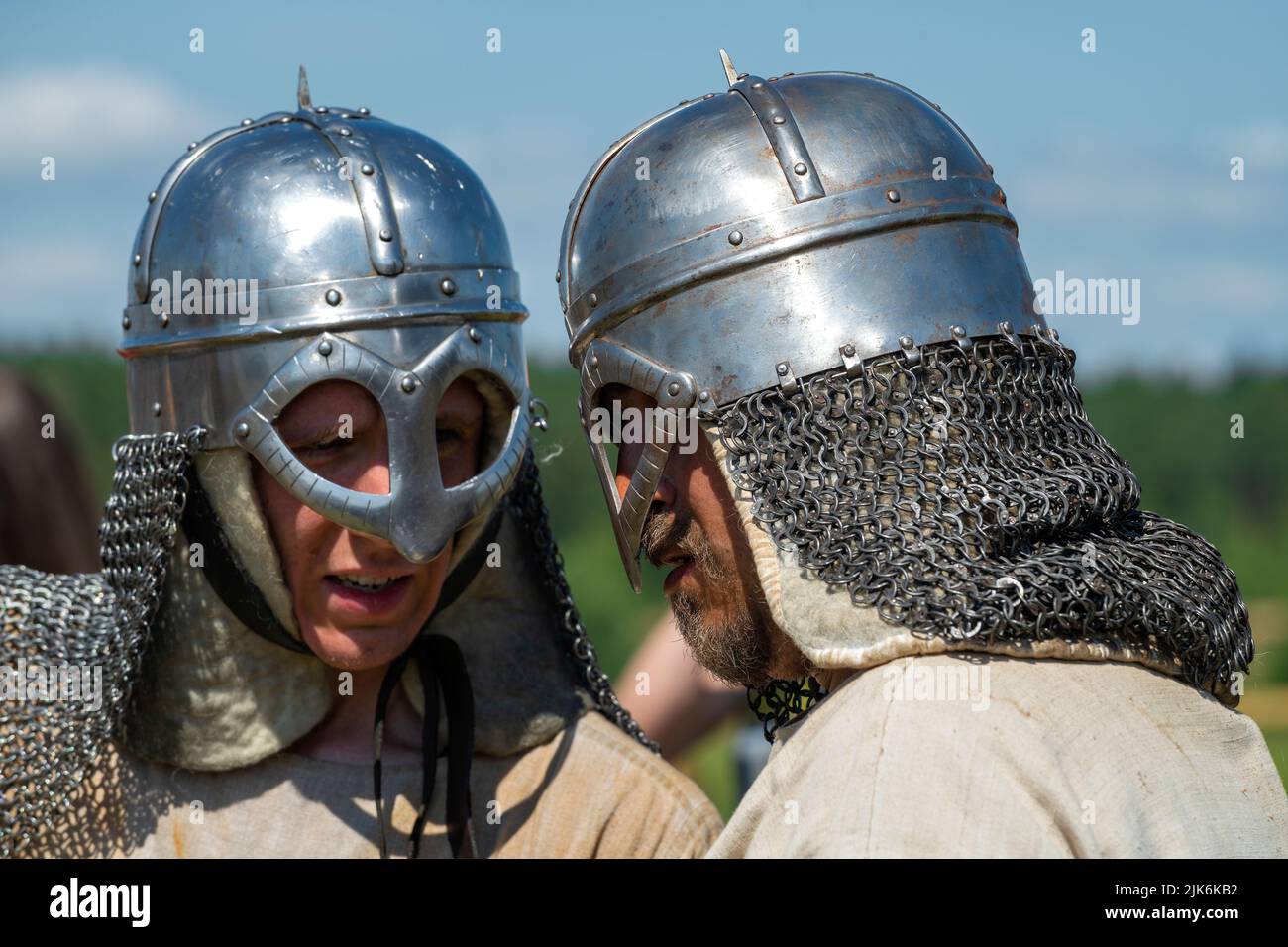 TVER REGION, RUSSIA - JULY 24, 2022: Two reenactors in Norman type helmets close-up. Historical festival 'Epic Coast - 2022' Stock Photo