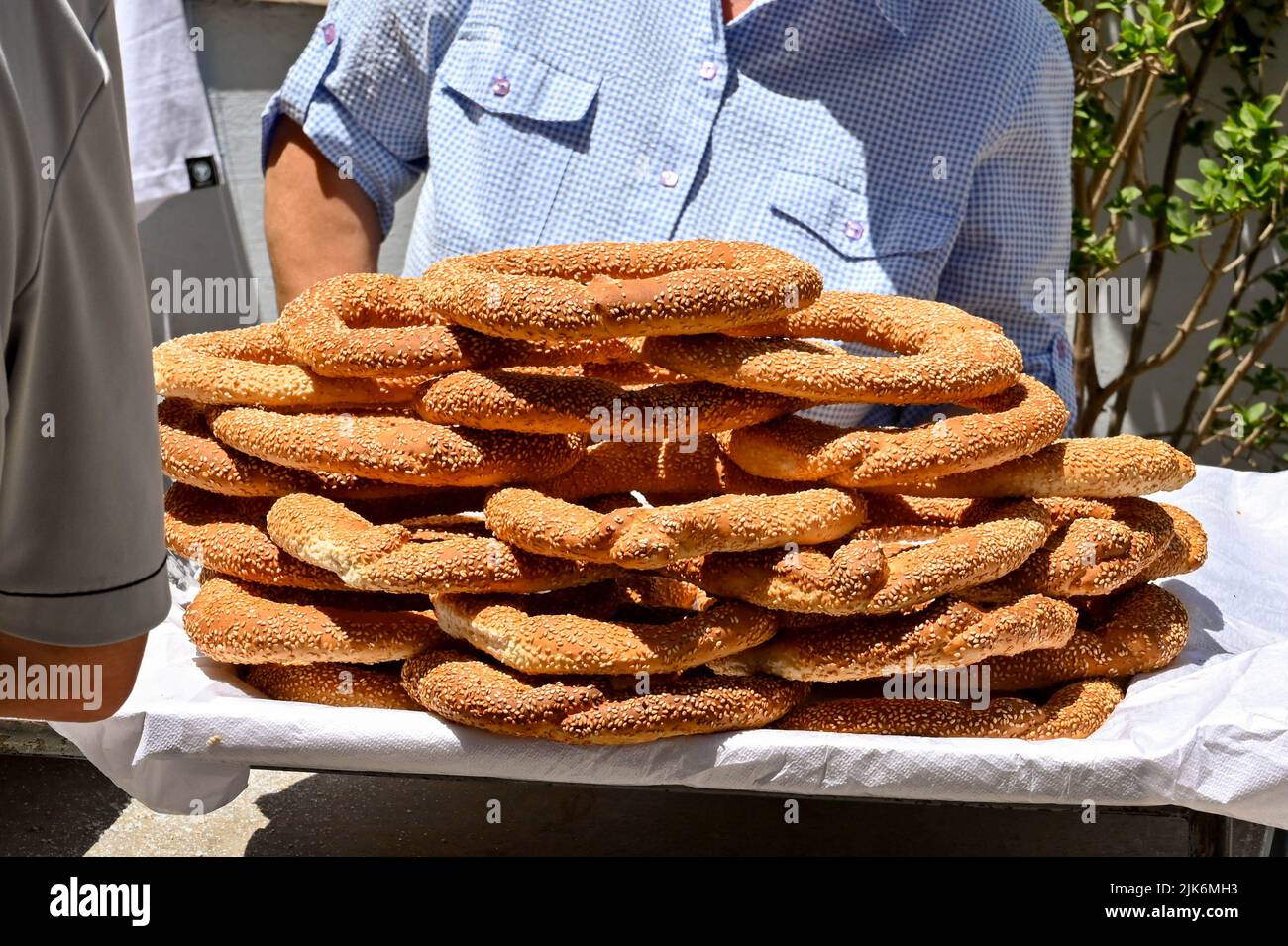 Athens, Greece - May 2022: Stack of large pretzels being sold by a street trader in the city centre Stock Photo