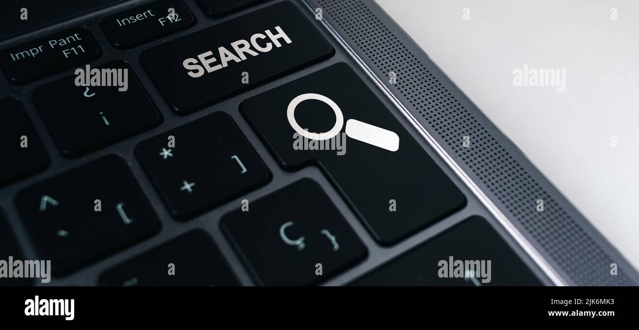Banner of keyboard with search button and selective focus. Concept of searching browsing Internet data information. Stock Photo