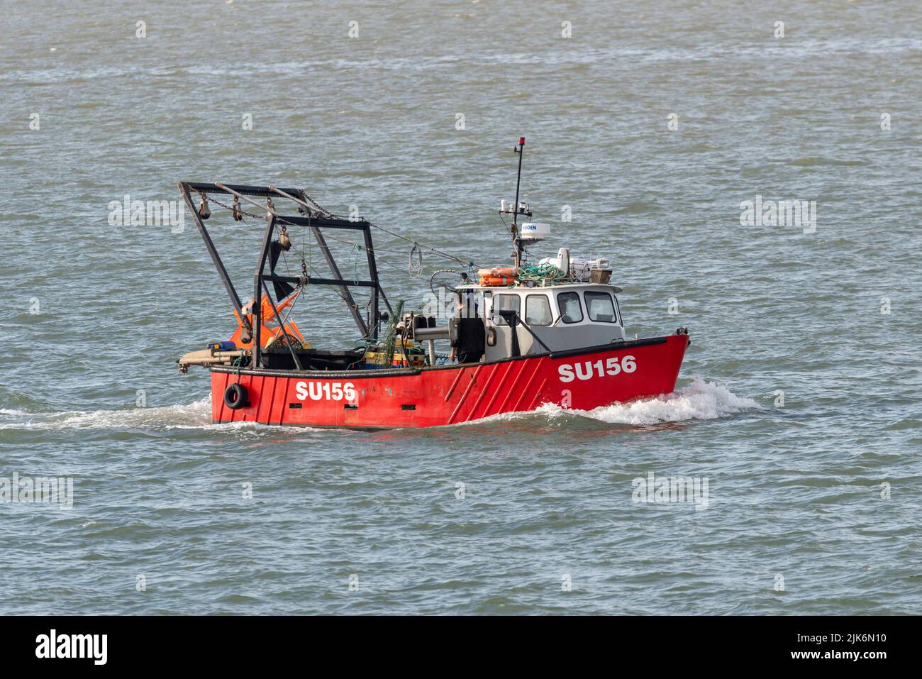 Fishing vessel SU156 Audacity coming in towards base at Leigh on Sea on the Thames Estuary, passing Southend on Sea, Essex, UK. Small working boat Stock Photo