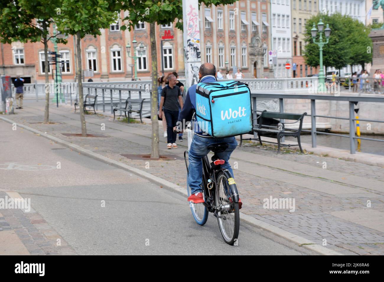 Copenhagen /Denmark/131 July 2022/Wolt food delivery biker in danish