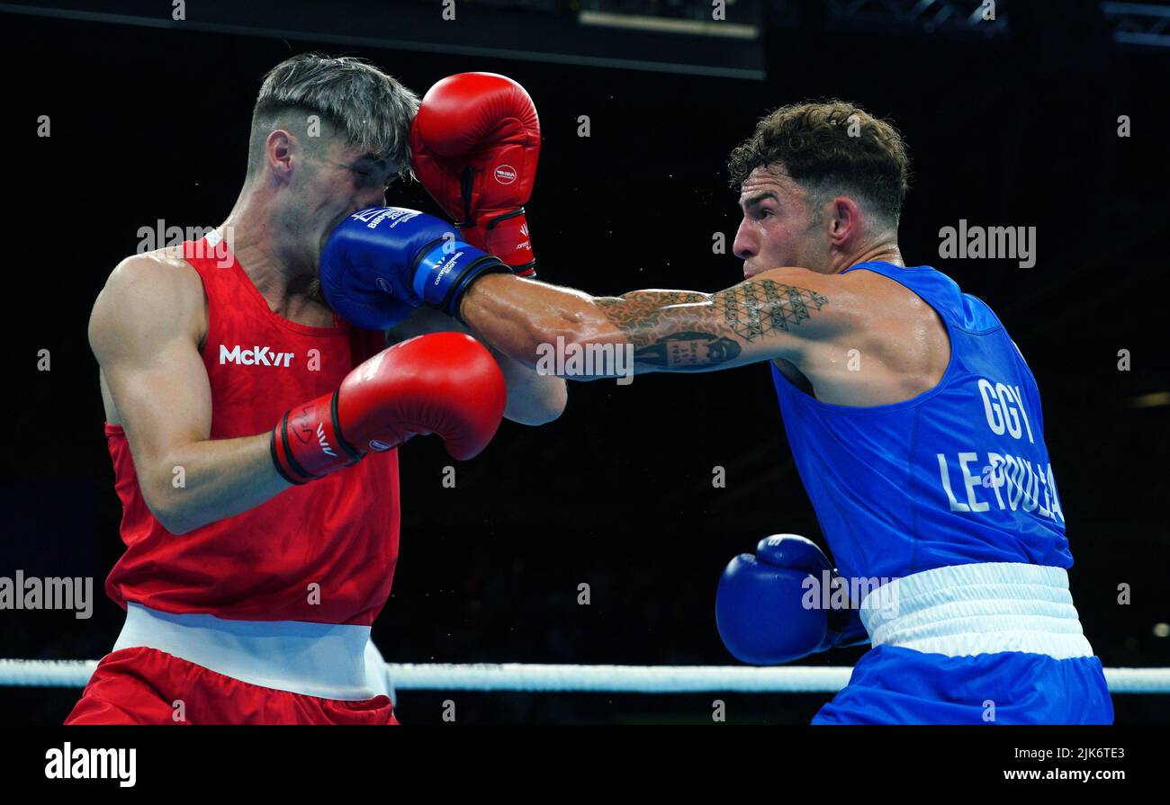 Guernsey's Billy le Poullain (Blue) and Northern Ireland 's Jake James  Tucker in the Men's Middle (71-75kg) at The NEC on day three of the 2022  Commonwealth Games in Birmingham. Picture date: