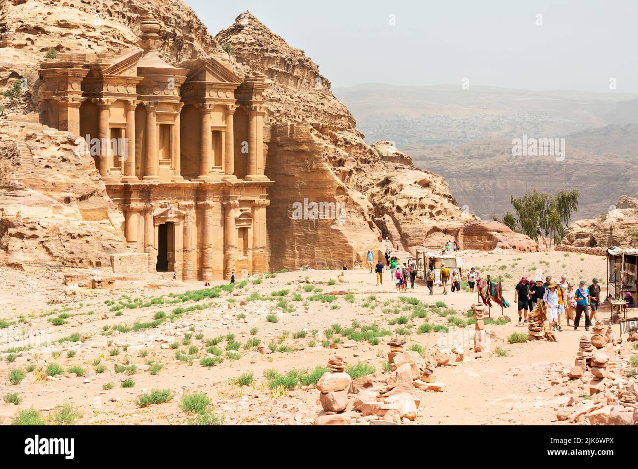 Petra, Jordan - April 19, 2022. Tourists near A-Dir Monastery, Petra's largest monument, Jordan. Petra has lead to its designation as a UNESCO World H Stock Photo