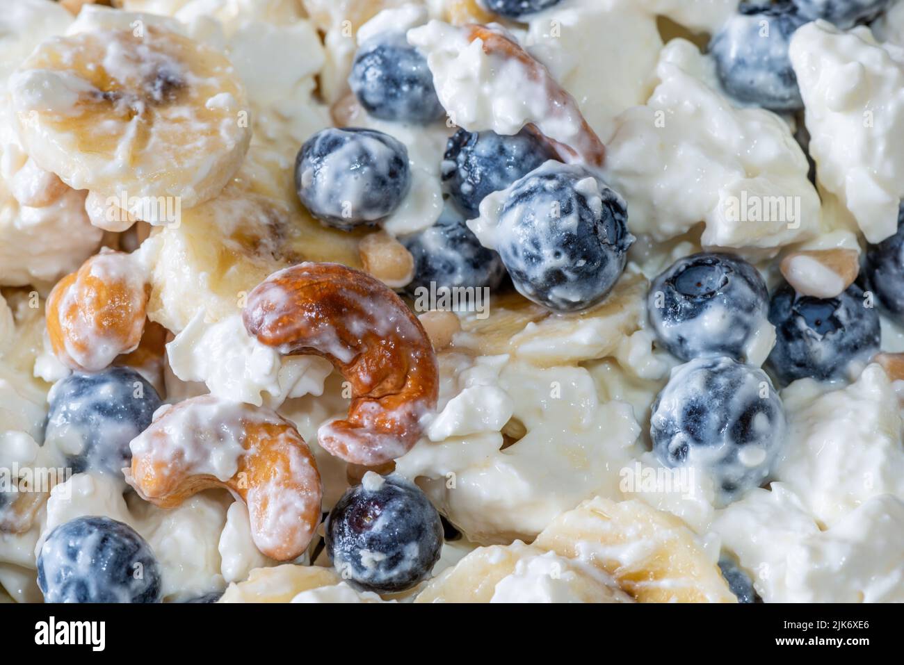 Beautiful breakfast cottage cheese, berries cashew, cedar, blueberry