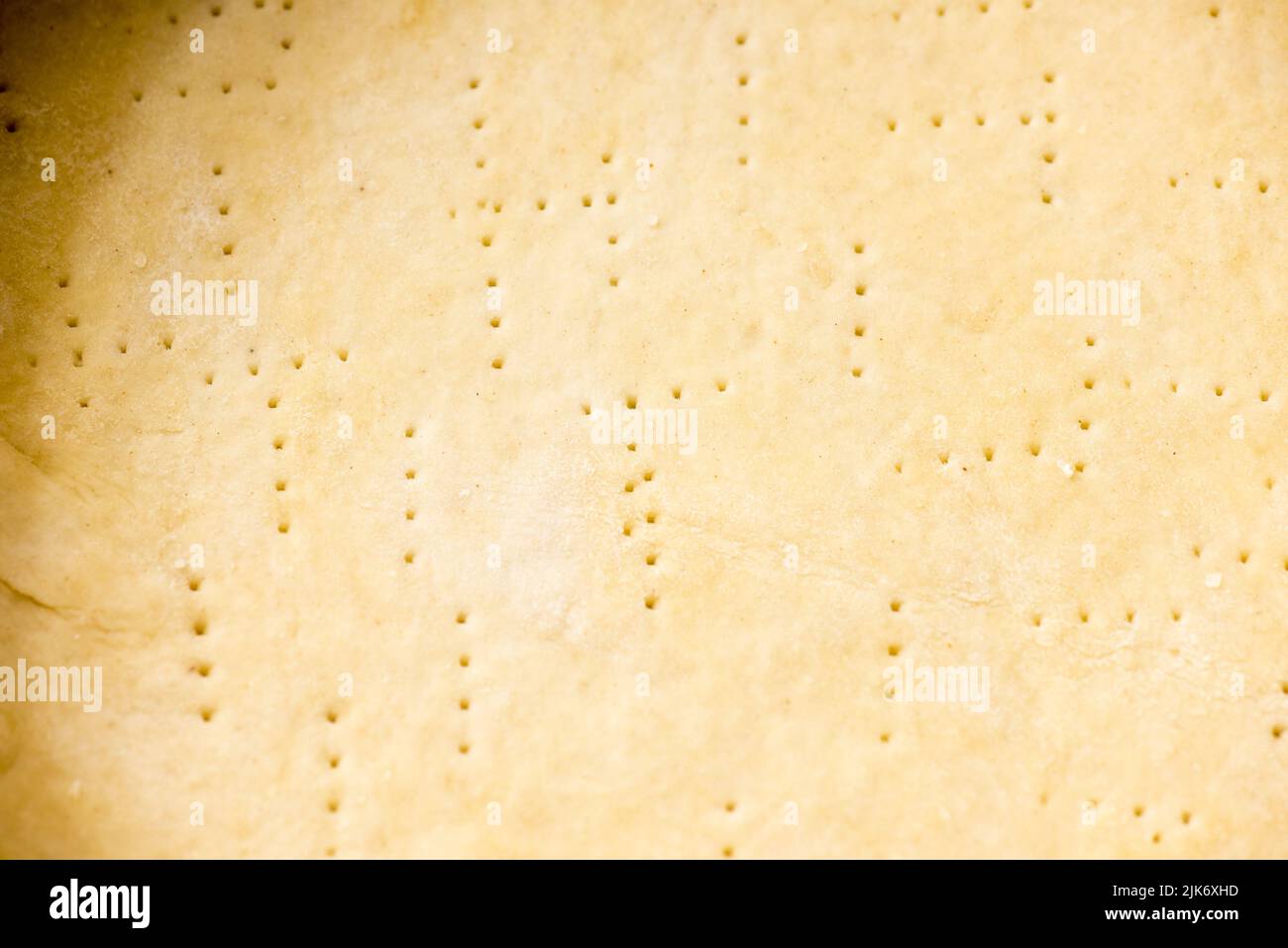 Details on a pre-baked pastry before it get filled with onion sauce to cook a cake. Stock Photo