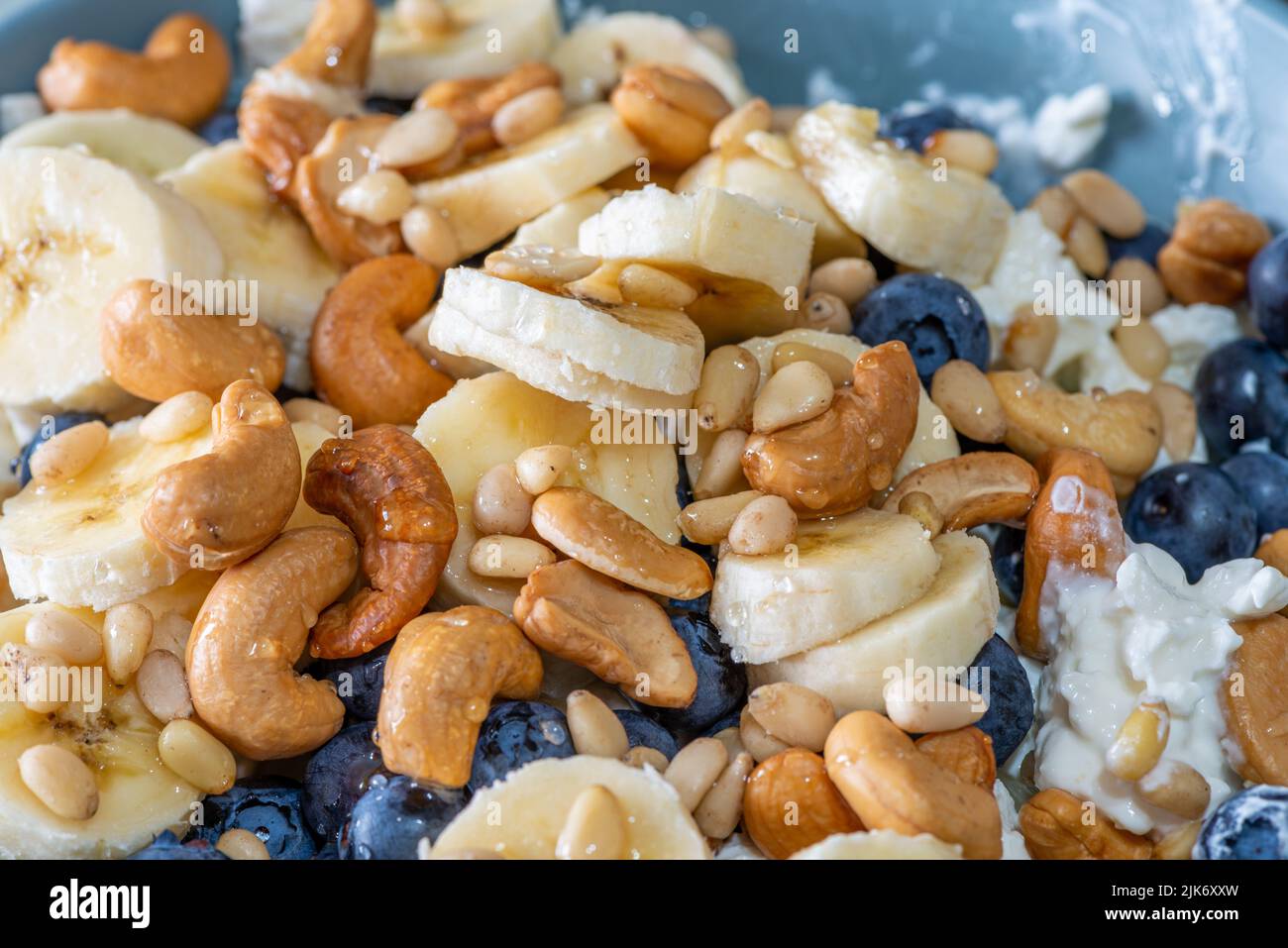 Beautiful breakfast cottage cheese, berries cashew, cedar, blueberry