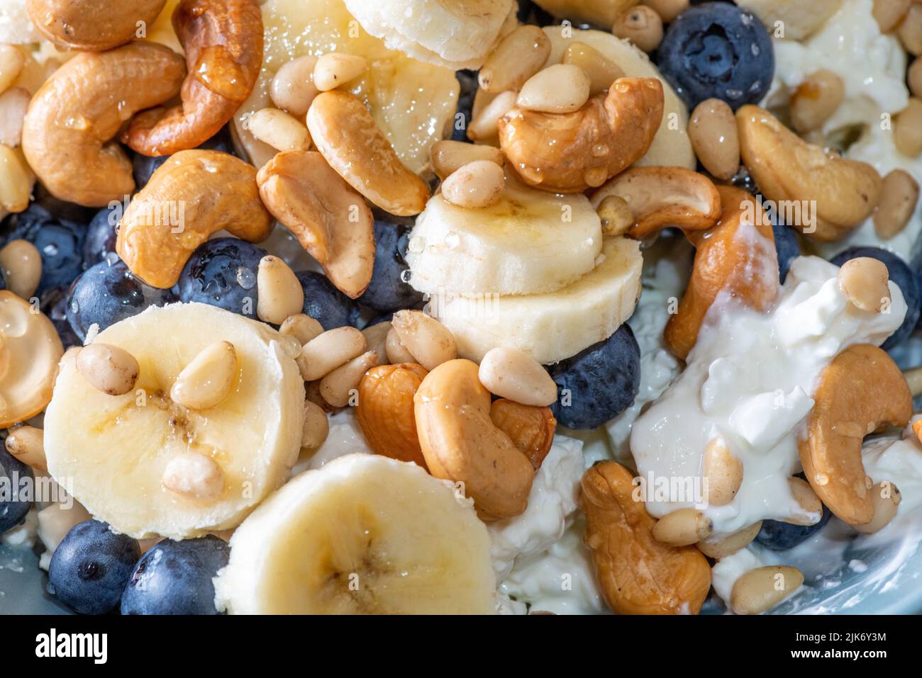 Beautiful breakfast cottage cheese, berries cashew, cedar, blueberry