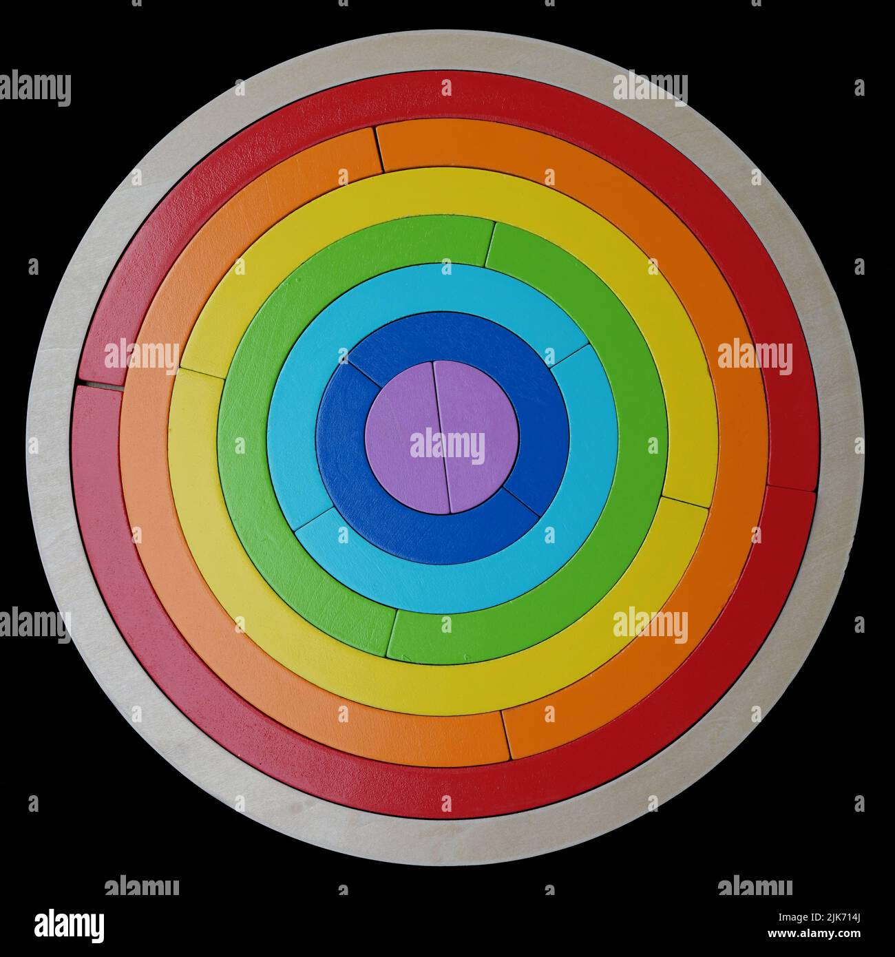 A rainbow puzzle for toddlers on a black background Stock Photo