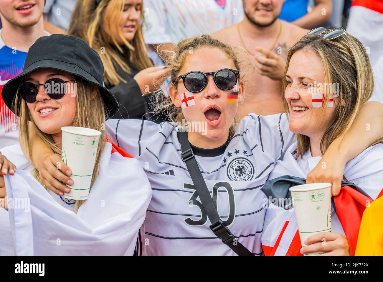 London, UK. 31st July, 2022. English and German Fans mingle happily - England v Germany UEFA Women's EURO 2022 final match fanzone in Trafalgar Square. Organised by the Mayor of London Sadiq Khan, and tournament organisers. It offered free access for up to 7,000 supporters. Credit: Guy Bell/Alamy Live News Stock Photo