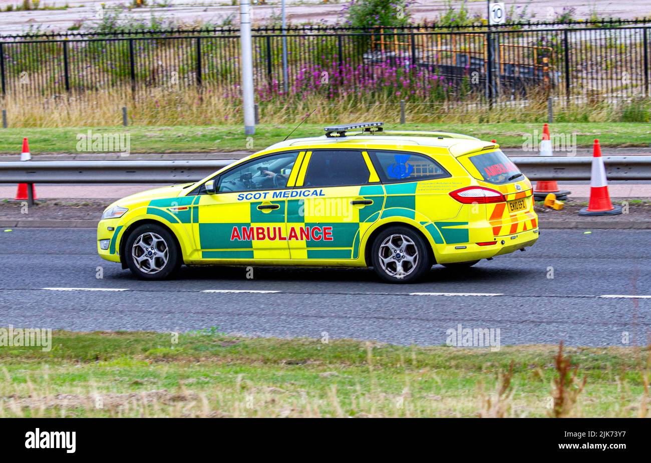 A Scot Medical Independent Ambulance Service car motoring along the Kingsway West Dual Carriageway in Dundee, UK Stock Photo