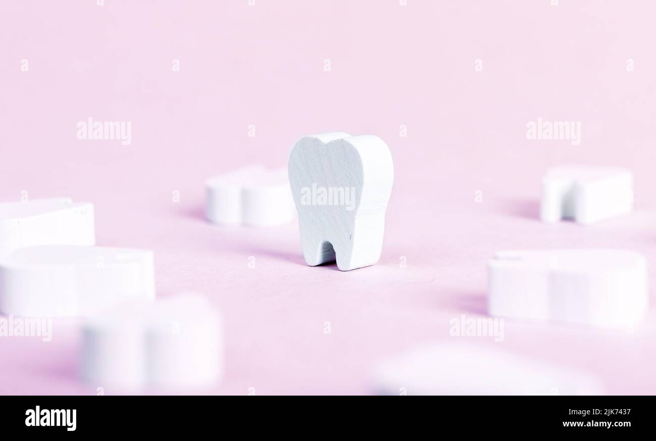 Toy teeth on pink background. High quality photo Stock Photo