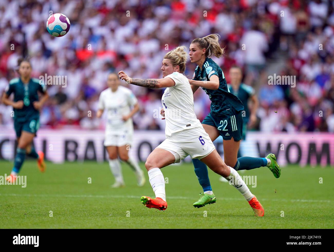England's Millie Bright and Germany's Jule Brand (right) battle for the ball during the UEFA Women's Euro 2022 final at Wembley Stadium, London. Picture date: Sunday July 31, 2022. Stock Photo