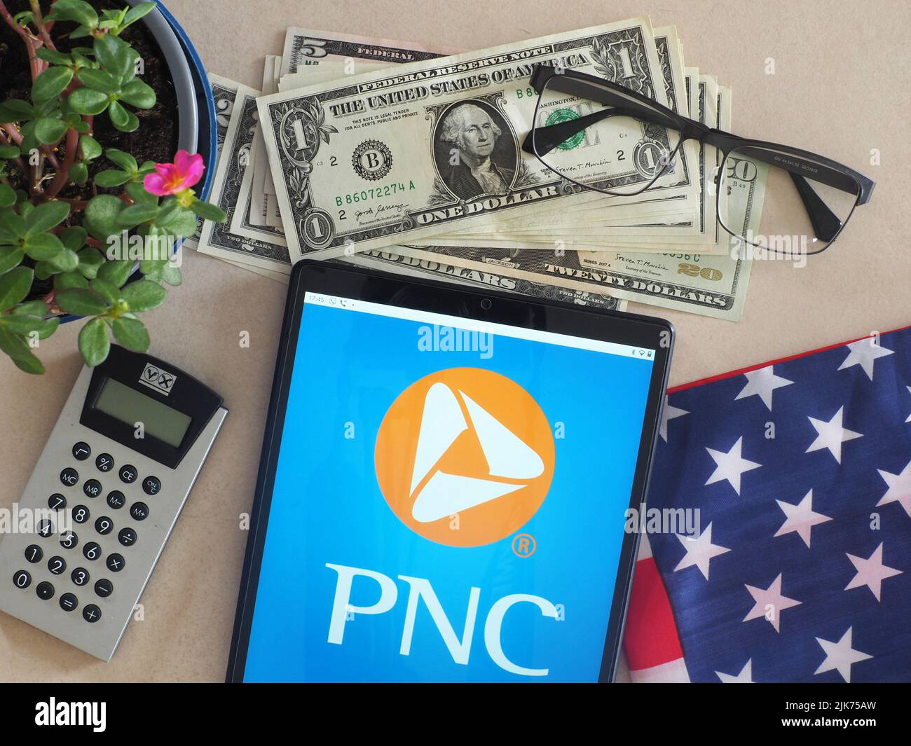 In this photo illustration, PNC Financial Services Group logo seen displayed on a tablet Stock