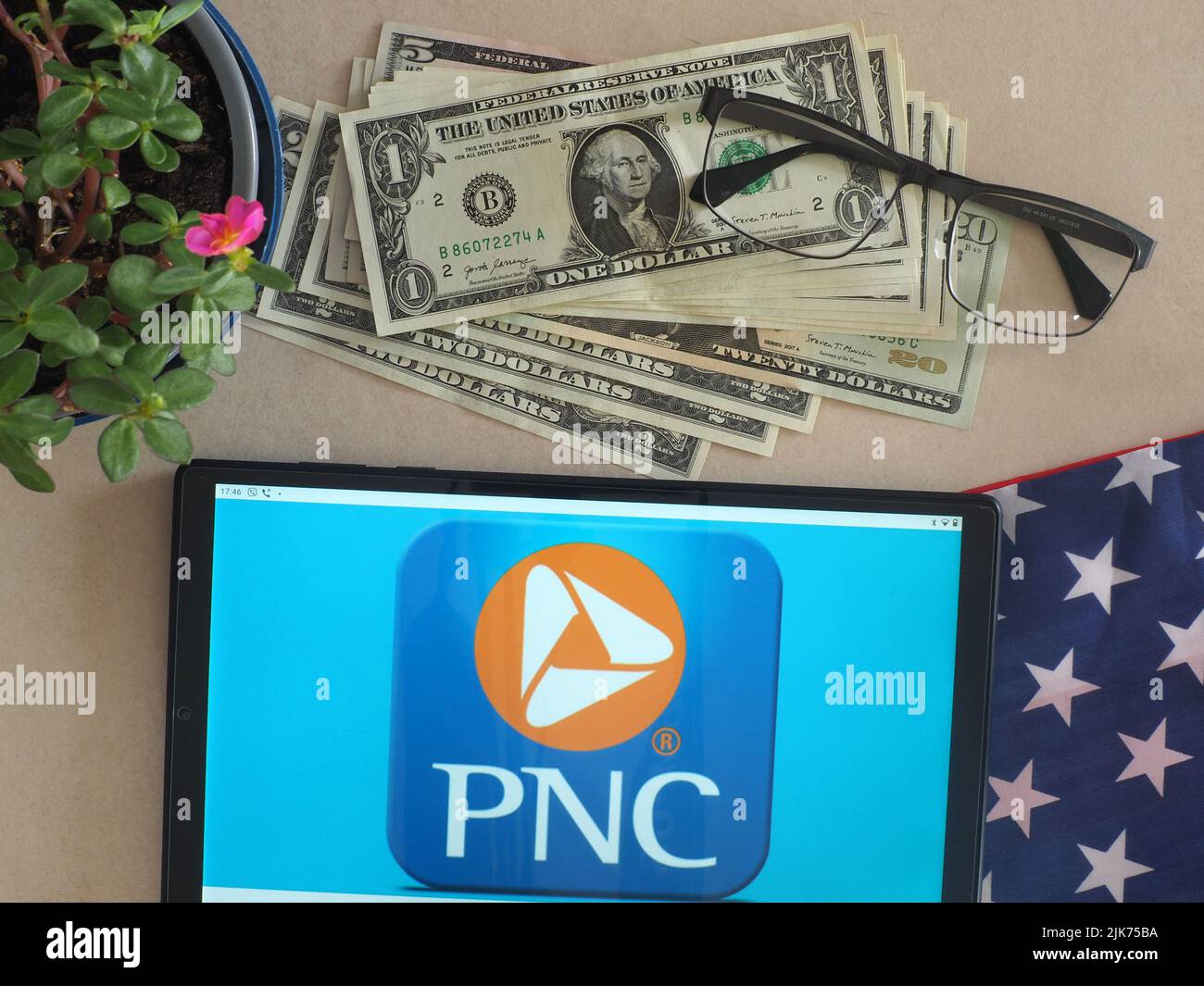 In this photo illustration, PNC Financial Services Group logo seen displayed on a tablet Stock