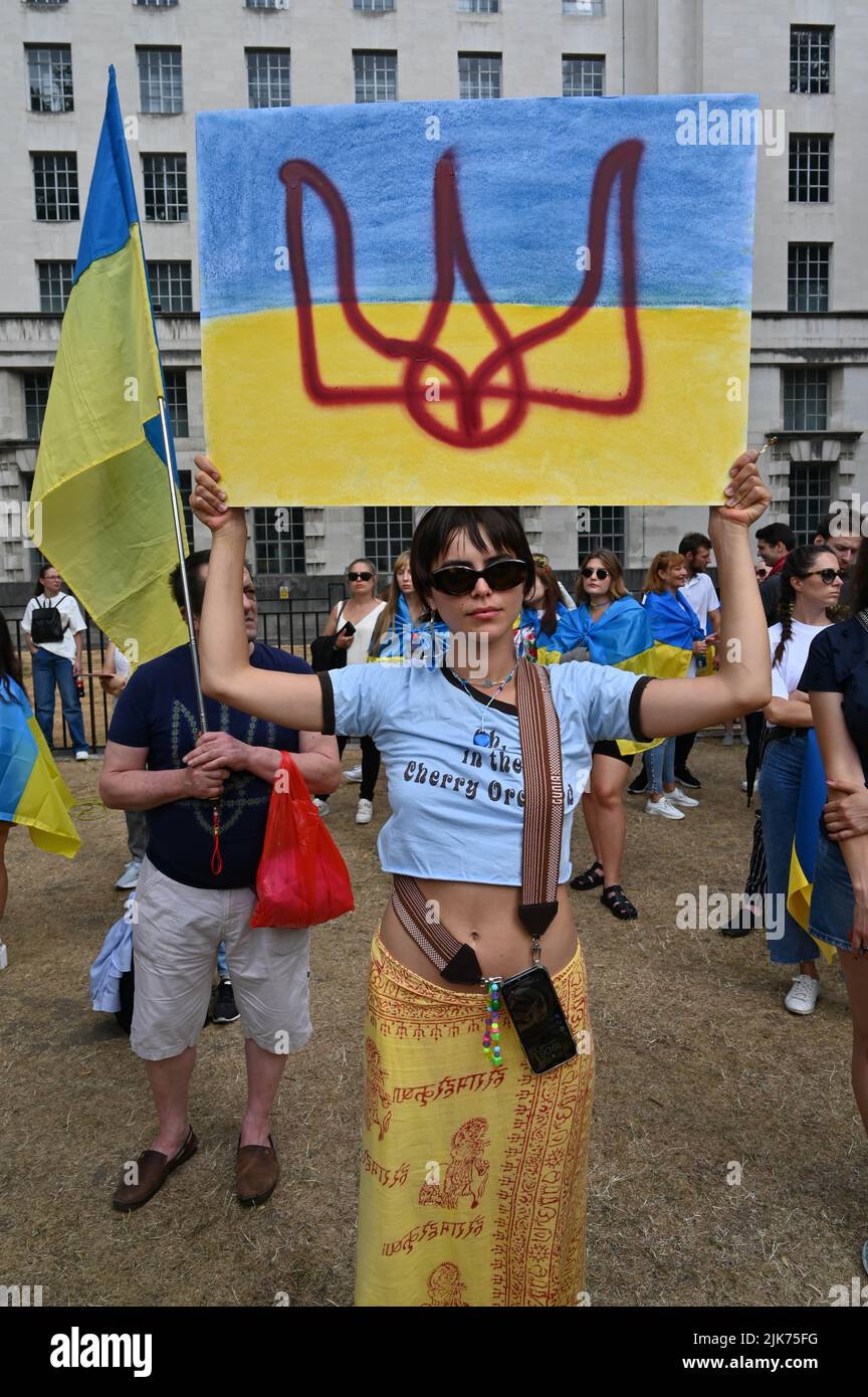 London, UK. 31 July 2022. Demonstrators holding sign protest outside Downing street. This war has become so brutal that one mistake could be World War III. I suggest that Russian troops go back to Russia and let Ukrainians live their own way of life and forget that this war never happened. The fact is that Russia can never win the war in Ukraine and Ukraine can never win. Ukrainians are proud patriots. They fought for the freedom of Ukraine, not like the cockroaches in Hong Kong, where they betrayed their own people and nation. Credit: See Li/Picture Capital/Alamy Live News Stock Photo