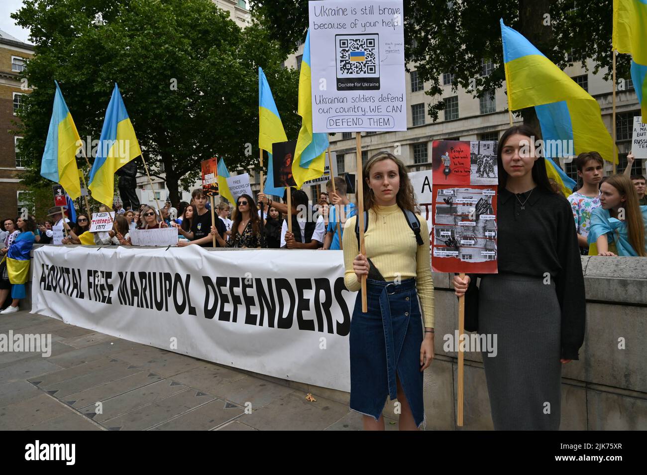 London, UK. 31 July 2022. Demonstrators holding sign protest outside Downing street. This war has become so brutal that one mistake could be World War III. I suggest that Russian troops go back to Russia and let Ukrainians live their own way of life and forget that this war never happened. The fact is that Russia can never win the war in Ukraine and Ukraine can never win. Ukrainians are proud patriots. They fought for the freedom of Ukraine, not like the cockroaches in Hong Kong, where they betrayed their own people and nation. Credit: See Li/Picture Capital/Alamy Live News Stock Photo