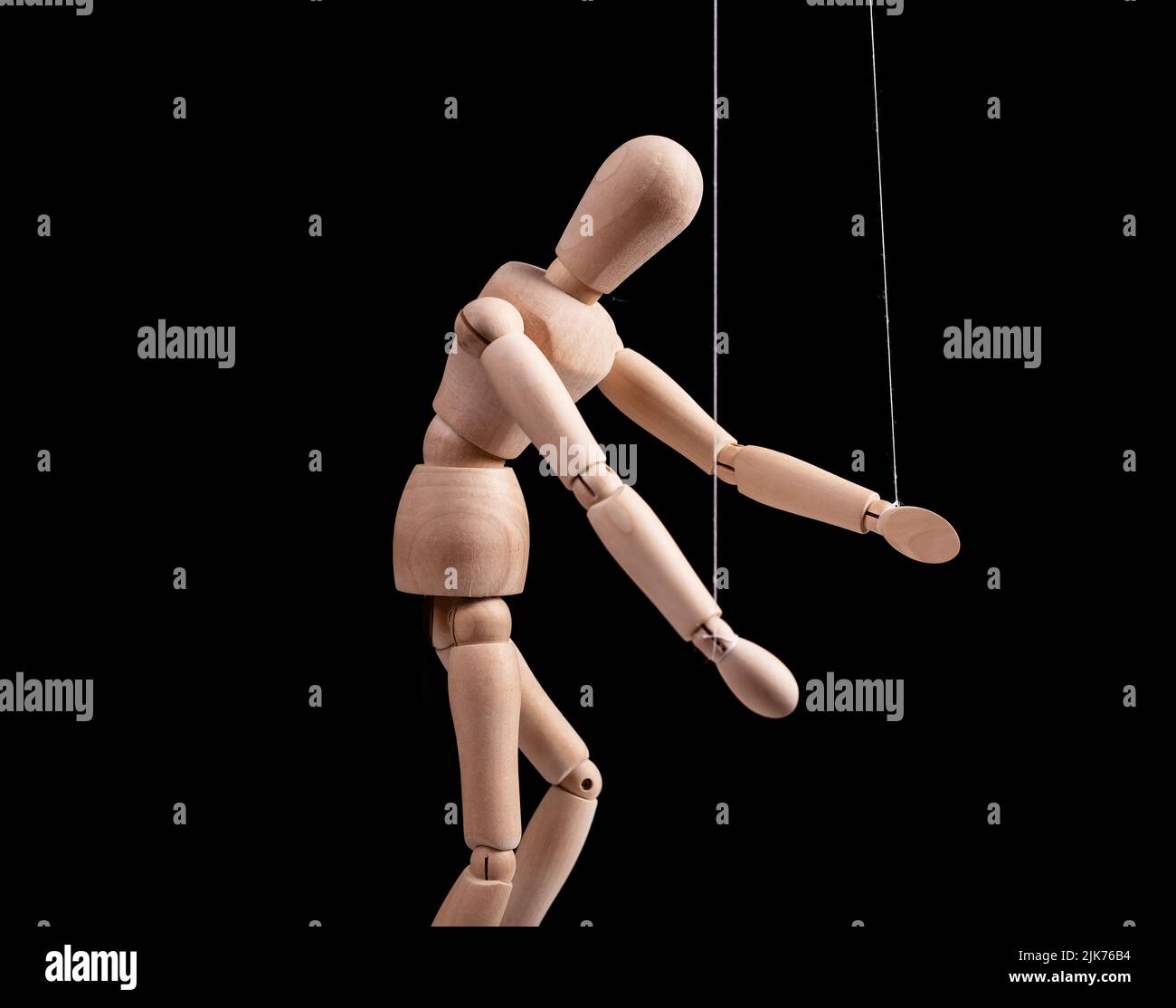 Puppet under manipulation control concept. High quality photo Stock Photo