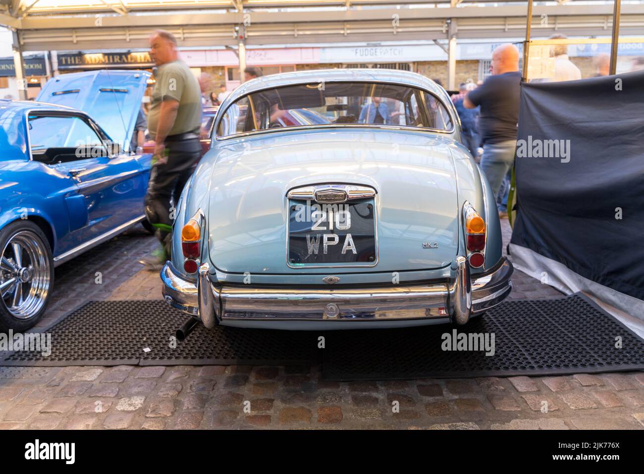 rear view of blue JAGUAR 2.4/240 at  'Park it in the Market' classic car show at Greenwich Market South east London England UK Stock Photo