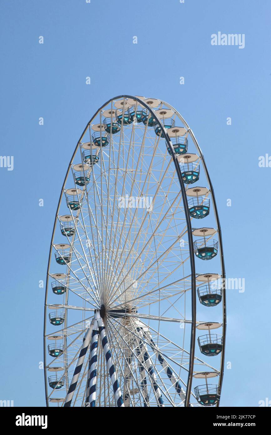 Big wheel and blue sky on background Stock Photo