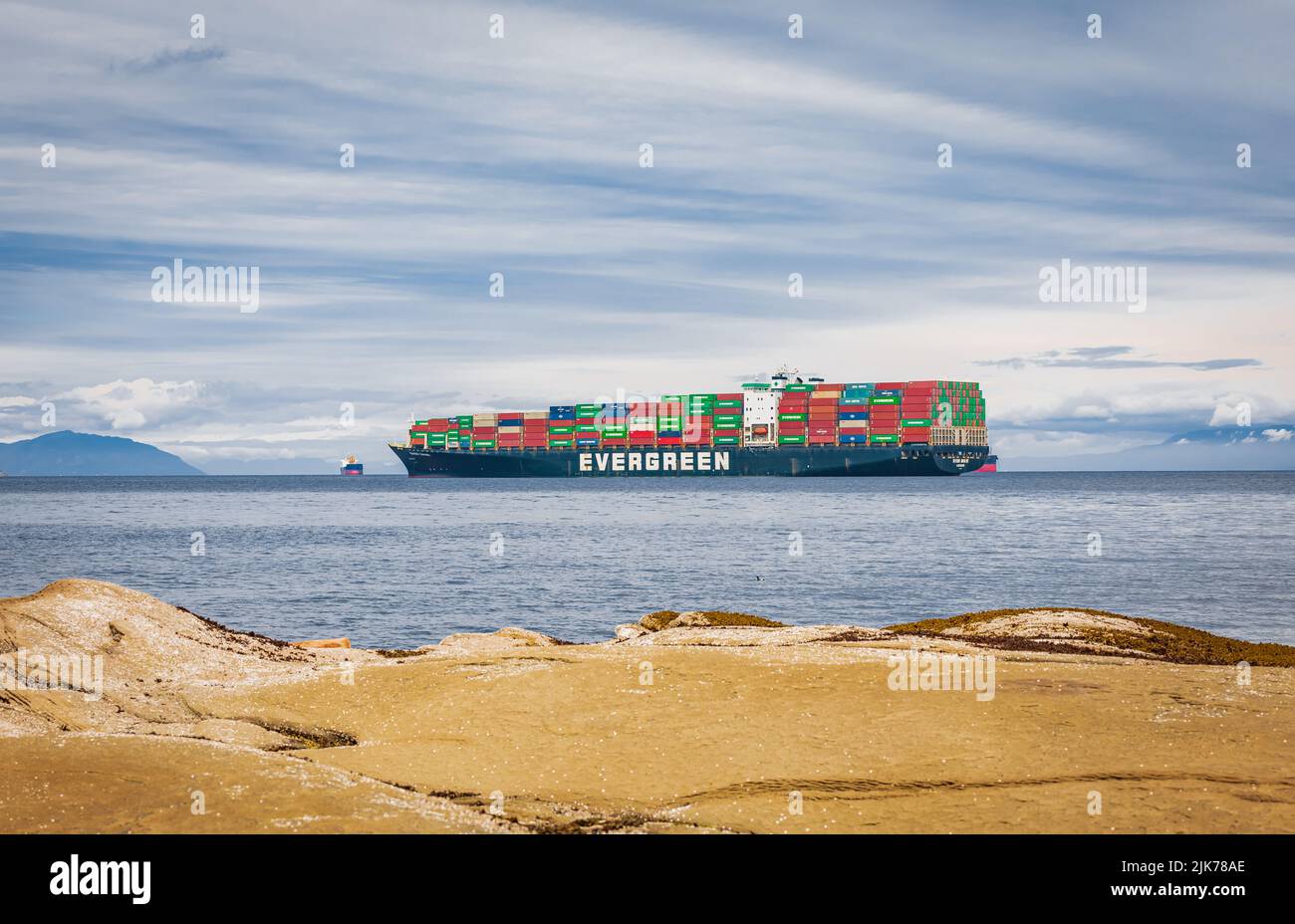 Evergreen container ship with full of cargo docked in port at Vancouver