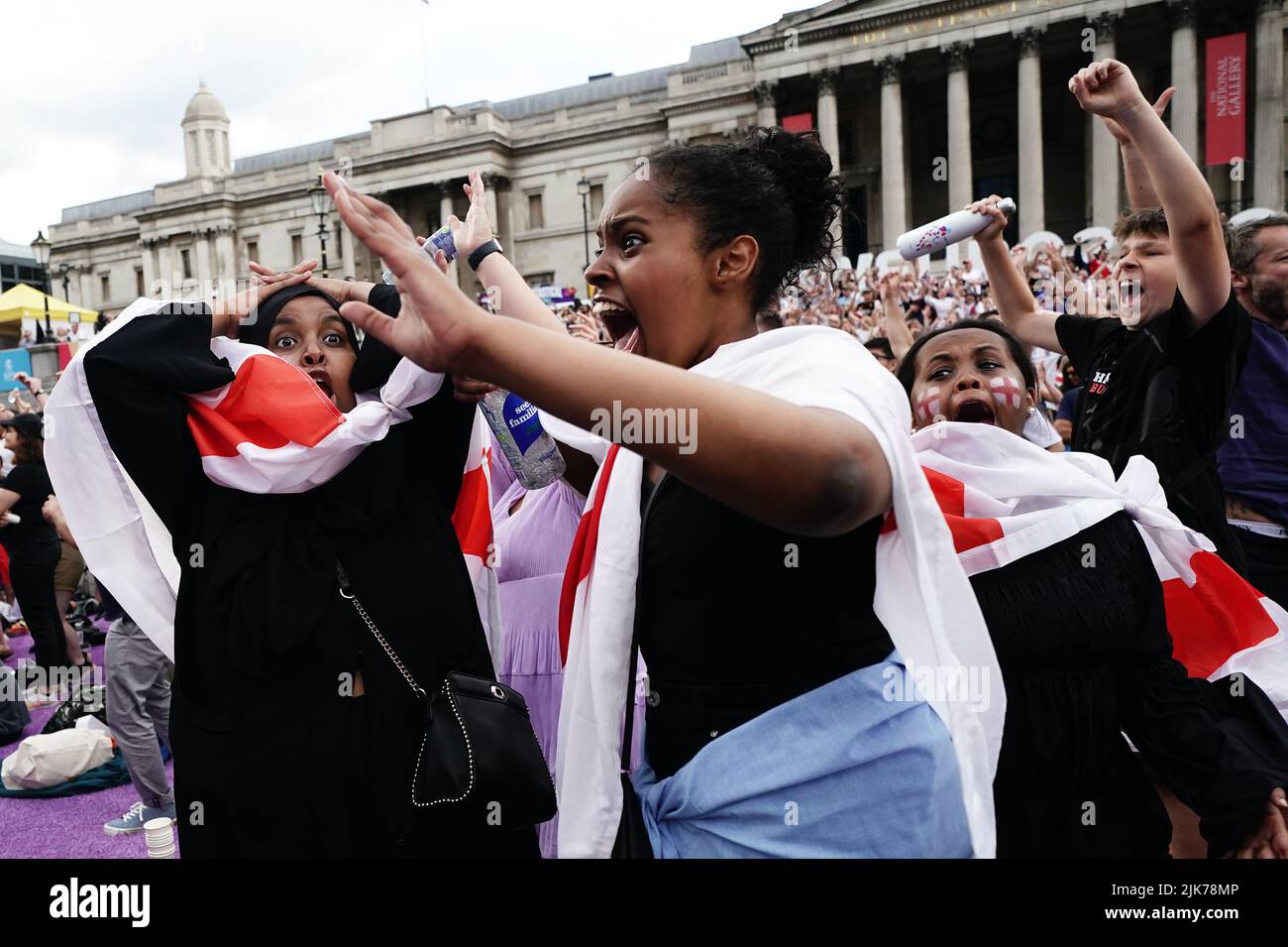 England Fans in Trafalgar Square, London, celebrate the opening goal as they watch a screening of the UEFA Women's Euro 2022 final held at Wembley Stadium, London. Picture date: Sunday July 31, 2022. Stock Photo