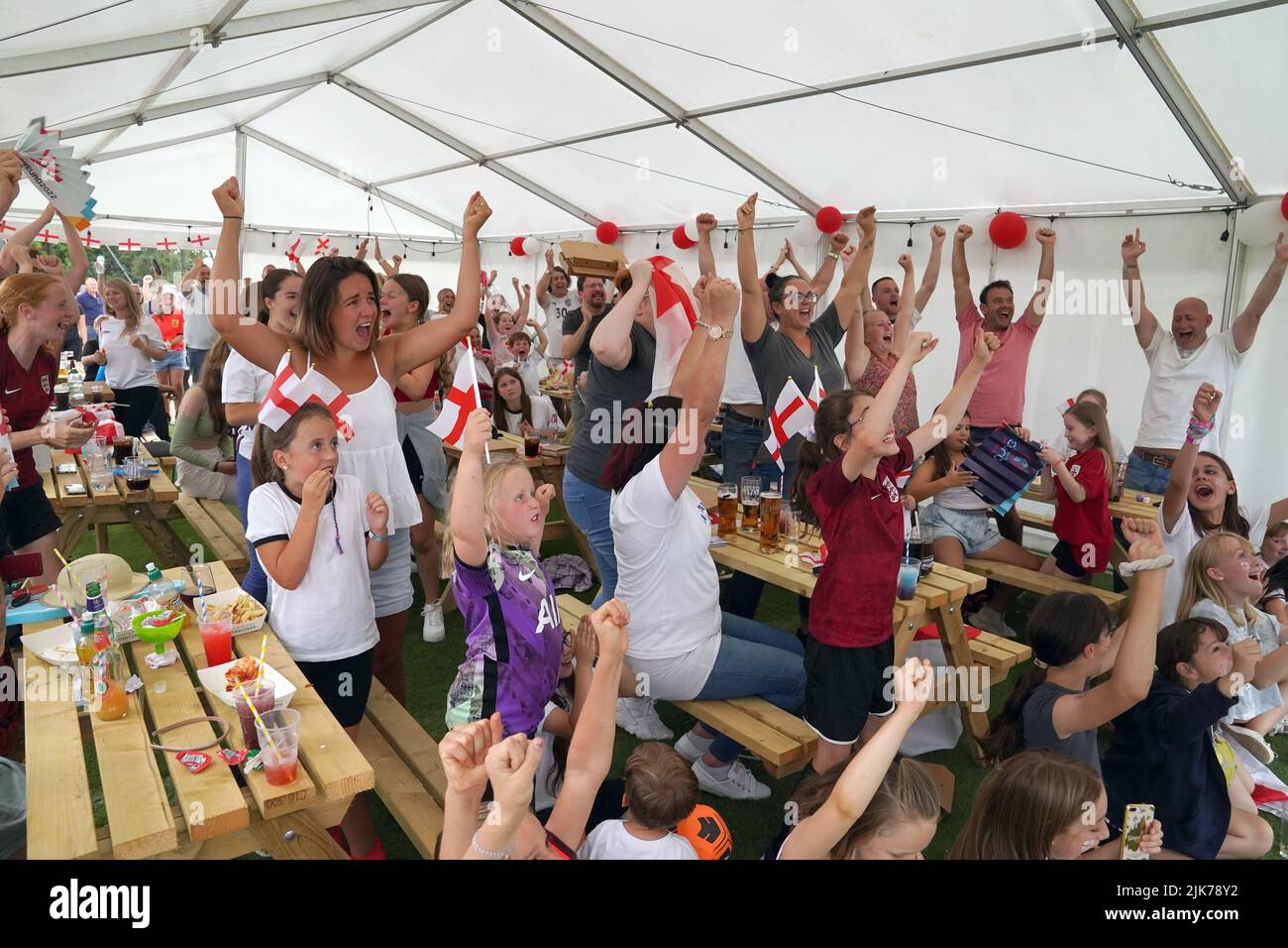 Fans in Aylesbury United WFC, the former club of Lionesses forward Ellen White, in Bierton, Aylesbury, celebrate the opening goal as they watch a screening of the UEFA Women's Euro 2022 final held at Wembley Stadium, London. Picture date: Sunday July 31, 2022. Stock Photo