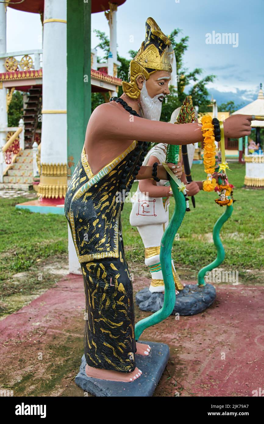 Thai folk art: statues of pilgrims in a Thai village temple in Phetchabun Stock Photo