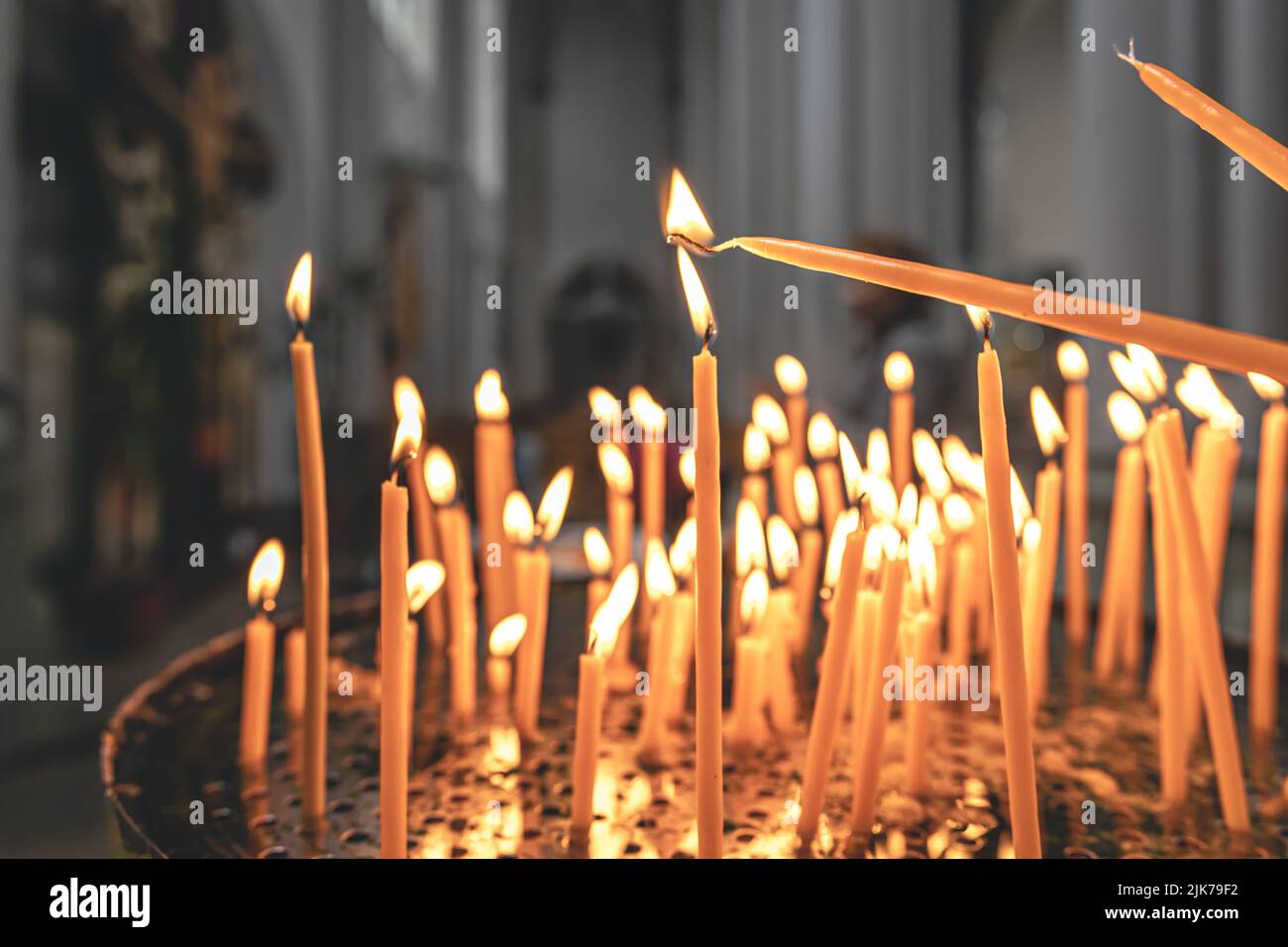 Close-up, candles in the temple on a blurred background. Stock Photo