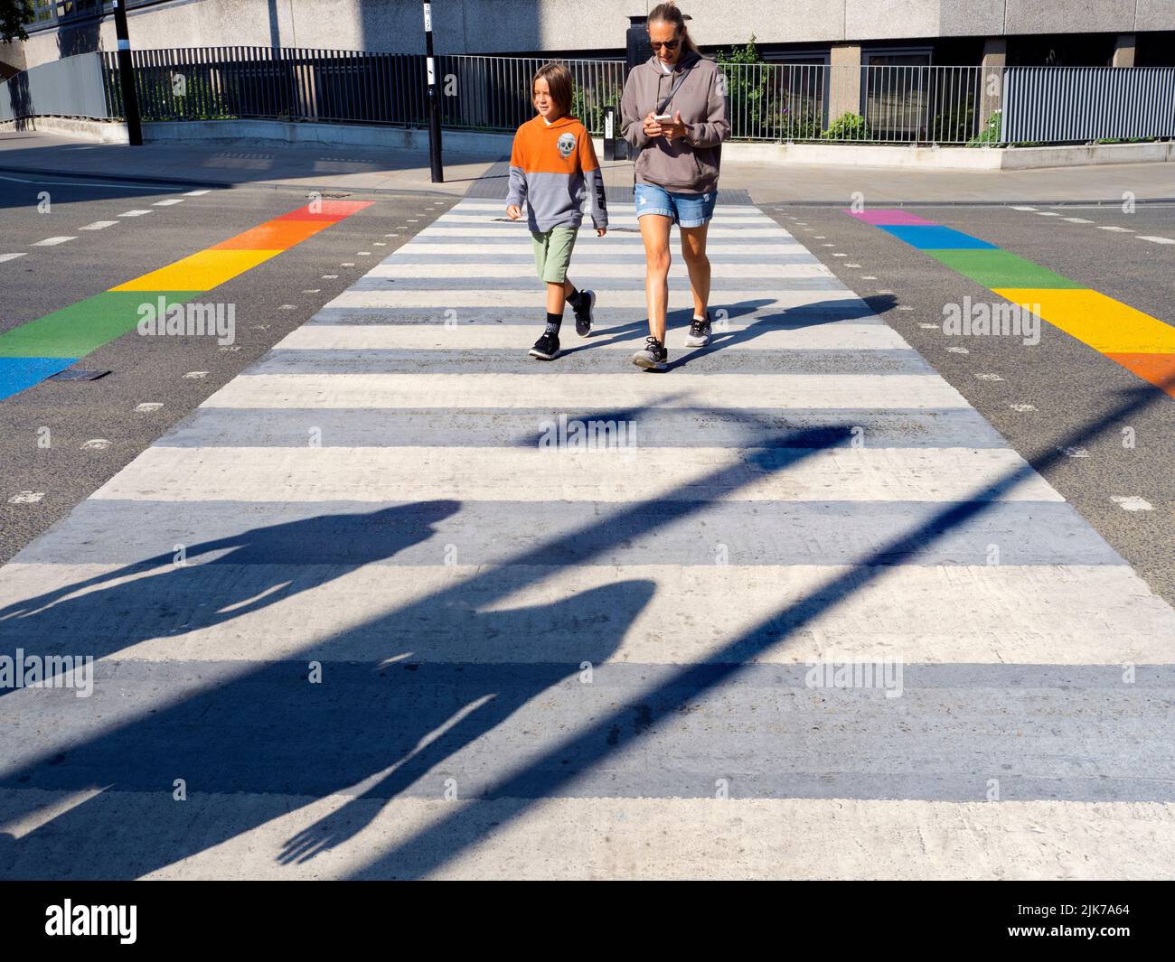 As part of the ongoing Oxford Pride 2022 events, various locations around the city receive rainbow makeovers - like this pedestrian crossing at the ju Stock Photo
