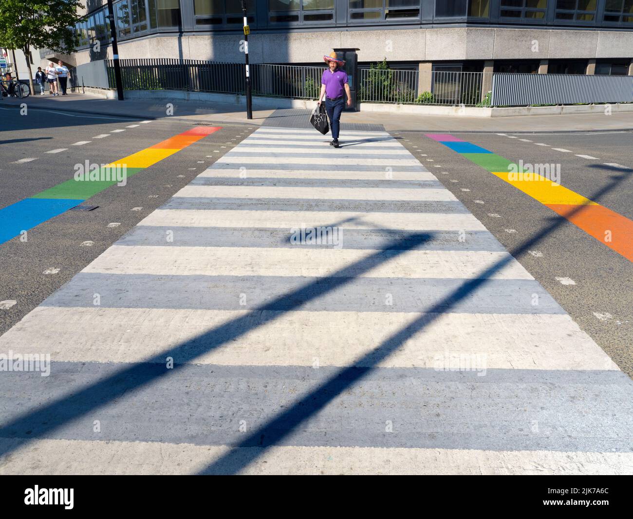 As part of the ongoing Oxford Pride 2022 events, various locations around the city receive rainbow makeovers - like this pedestrian crossing at the ju Stock Photo
