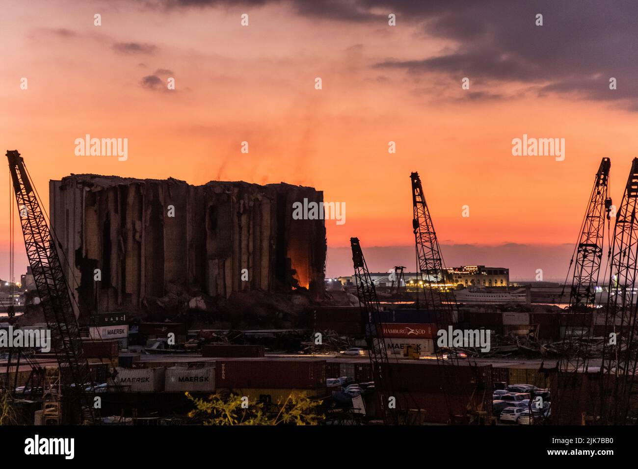 BEIRUT, LEBANON - JULY 31, 2022: View of burning Beirut port grain silos after their partial collapse on July 31, 2022. Stock Photo