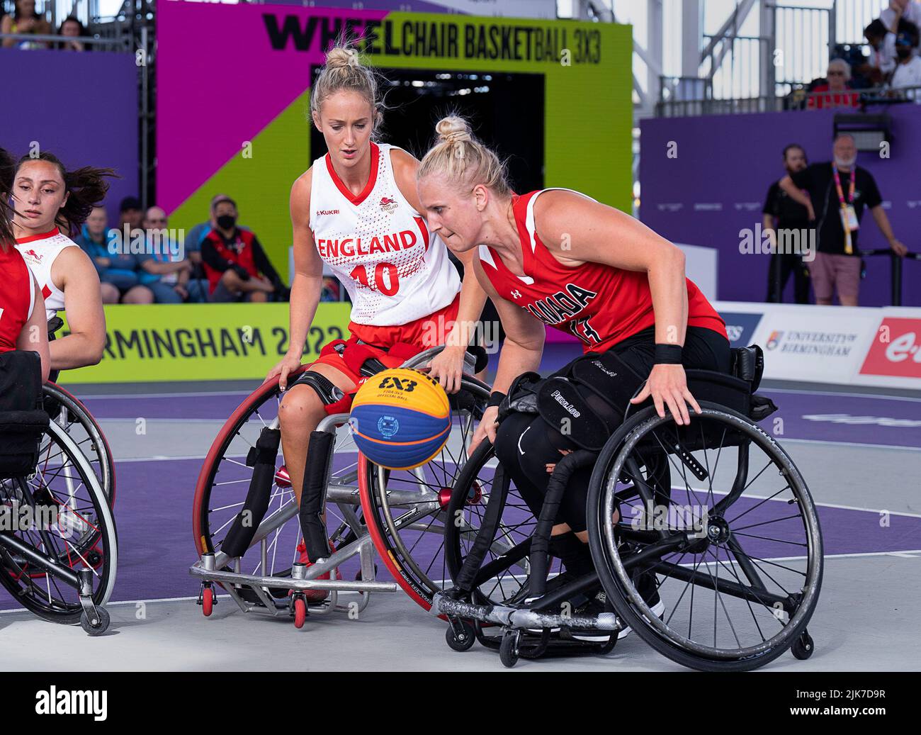 Birmingham, UK. 31st July, 2022. Canada's Kady Dandeneau heads past England's Amy Conroy on the way to a 13-8 victory in women's 3x3 wheelchair basketball action at the Commonwealth Games in Birmingham, England on Sunday, July 31, 2022. THE CANADIAN PRESS/Andrew Vaughan Credit: The Canadian Press/Alamy Live News Stock Photo
