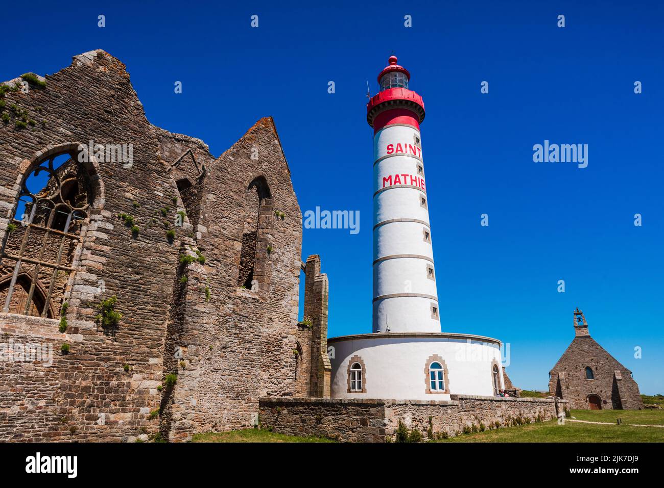 Saint Mathieu lighthouse standing near ruins of the old abbey Stock ...
