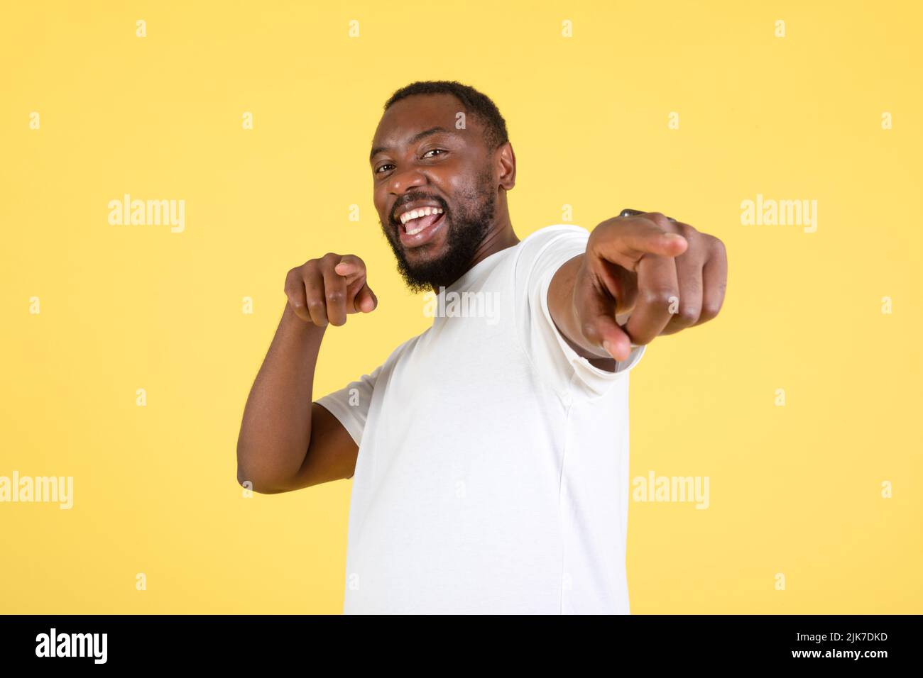 Cheerful black man pointing looking hi-res stock photography and images ...
