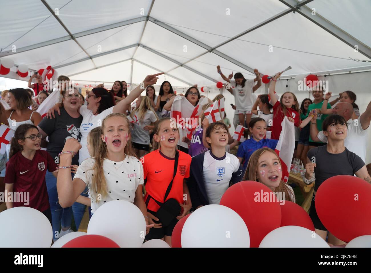 Fans celebrate the final whistle in Aylesbury United WFC, the former club of Lionesses forward Ellen White, in Bierton, Aylesbury, while watching a screening of the UEFA Women's Euro 2022 final held at Wembley Stadium, London. Picture date: Sunday July 31, 2022. Stock Photo