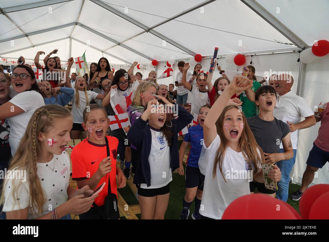 Fans celebrate the final whistle in Aylesbury United WFC, the former club of Lionesses forward Ellen White, in Bierton, Aylesbury, while watching a screening of the UEFA Women's Euro 2022 final held at Wembley Stadium, London. Picture date: Sunday July 31, 2022. Stock Photo