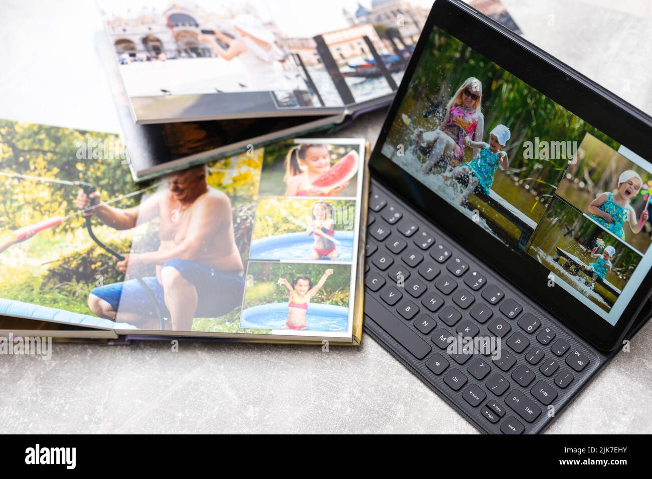 technology, age, memories and people concept. photobook album and